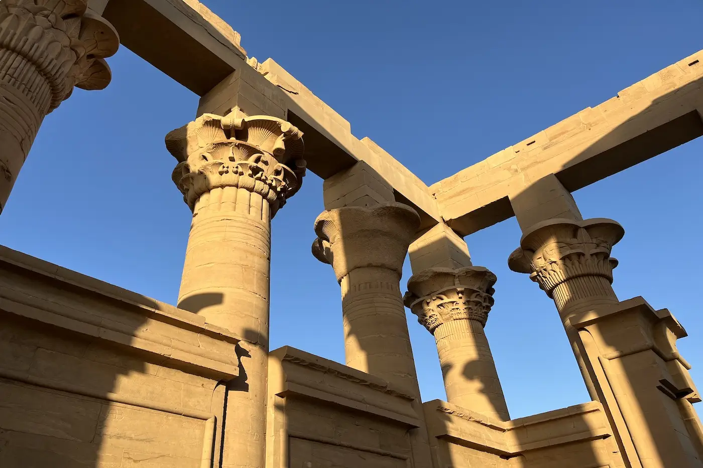 Philae Temple in bright daylight during the cooler travel season in Aswan