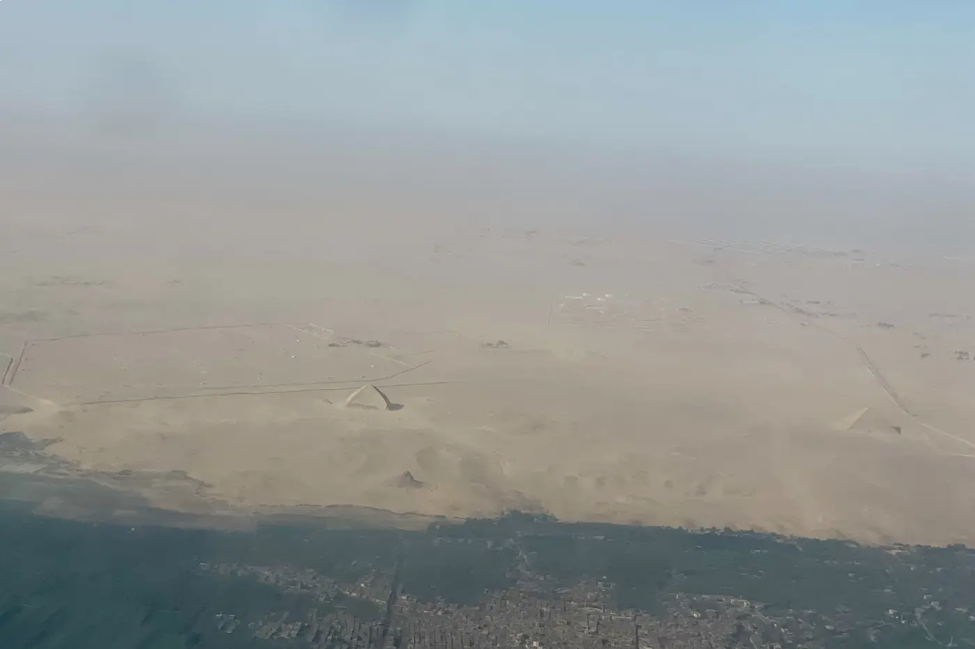 Aerial view of the Giza pyramid complex on a four day Cairo itinerary